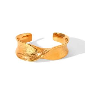 Textured gold-plated twisted open bangle with geometric wave design and hammered finish