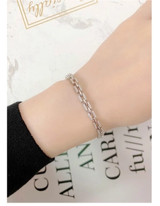 Detail of 925 sterling silver bracelet with rectangle links and cubic zirconia setting