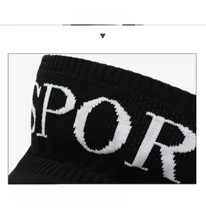 Close-up of black knitted sun visor fabric with white embroidered SPORT letters detail