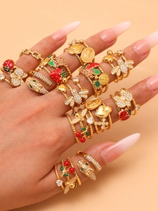 Detailed view of layered 18k gold-plated open rings with enamel insects and zircons