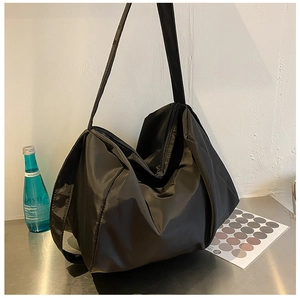 Close-up of lightweight black oxford fabric sports bag highlighting texture and large capacity