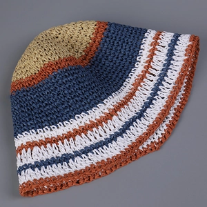 Detailed view of handwoven striped straw bucket hat showing vibrant colors and weave