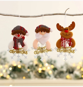 Detailed view of plush Santa, Snowman, and Reindeer ornaments hanging on a Christmas tree