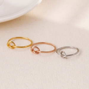 Minimalist knot rings in gold, rose gold and silver stainless steel finishes
