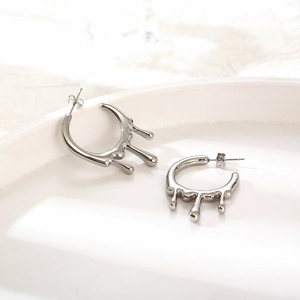 Polished silver molten lava drop stud earrings in high-gloss fluid metal style