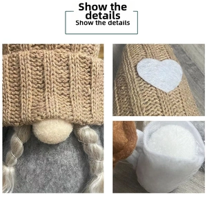 Close-up of knitted coffee gnome ornament featuring braided hats and felt heart details