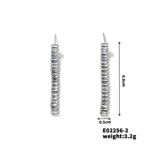 Detail showing silver tassel earrings with cubic zirconia and 4.8cm length dimensions