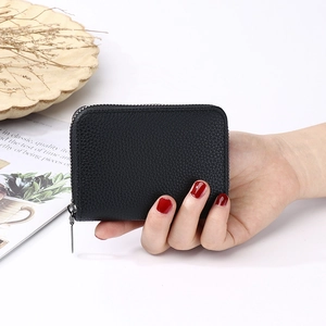 Black leather accordion card holder wallet with lychee texture and silver zipper detail