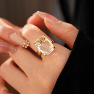 Macro shot of a 14k gold plated ring featuring a large rectangular cubic zirconia stone
