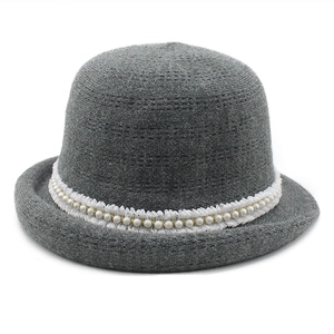 Grey knitted cloche hat with white lace trim and pearls decoration for winter