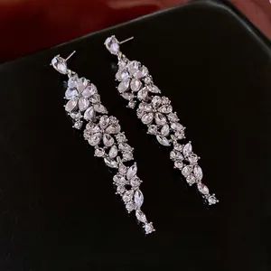 Elegant floral tassel earrings with sparkling rhinestones and silver-plated needle studs