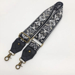 Ethnic jacquard wide shoulder strap for bags with bronze metal hooks and black leather ends