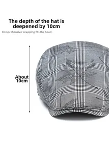 Detail view of grey plaid ivy cap showing the 10cm deep crown and maple leaf embroidery
