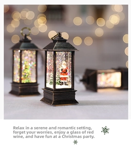 Detail of vintage bronze Christmas lanterns with warm LED light and Santa scenery