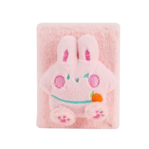 Detailed view of pink plush rabbit notebook with cute 3D ears and embroidered carrot