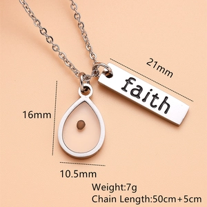 Macro shot of silver Faith pendant with dimensions 21mm and 16x10.5mm on a 50cm chain