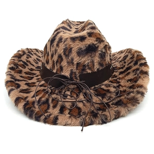Detail of plush leopard print cowboy hat featuring a brown leather decorative band