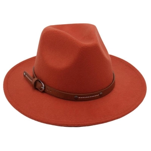 Detailed view of brick red wool fedora hat with brown leather belt buckle and metal studs