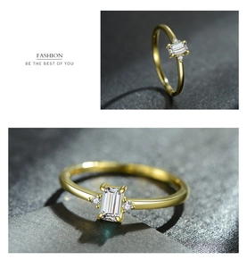 Detailed view of s925 silver ring featuring emerald cut cubic zirconia on dark background