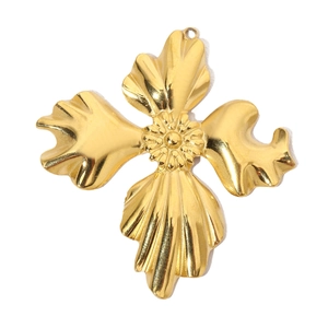 Detail of vintage flower pendant in gold titanium steel with rhinestone accents