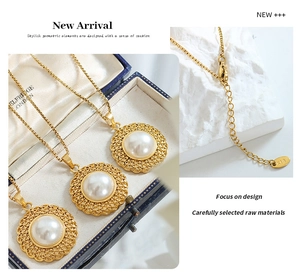Detail of gold necklace set with straw hat design and pearl inlay on a jewelry box