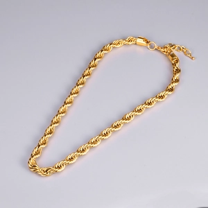 Detail of gold rope chain necklace with lobster clasp and adjustable extension chain