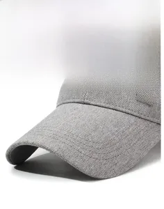 Detail of grey mesh baseball cap featuring a metallic SORT logo on the durable fabric side
