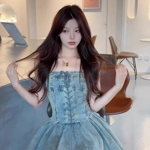 Water washed blue denim tube dress with corset lacing and gold butterfly necklace