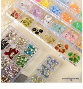 Detail of 12-grid transparent nail art storage box with separate lids and compartments
