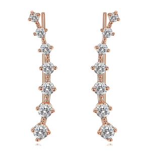 Macro detail of rose gold crawler earrings with seven graduated cubic zirconia stones