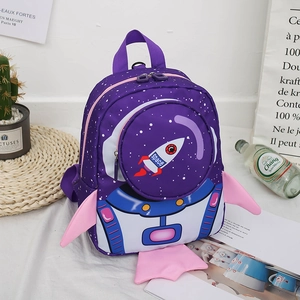 Detail view of purple rocket penguin toddler backpack with cute 3D wings and space print