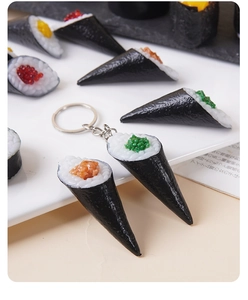 Macro view of realistic Temaki sushi keychain with seaweed and fish roe details