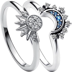 Celestial sun and moon ring set in silver with sparkling blue and white crystals