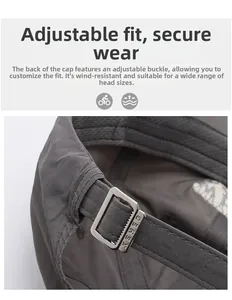 Détail de la boucle métallique réglable sur la casquette de soleil gris foncé séchage rapide