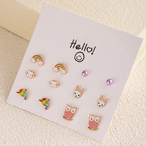 7-pair cute earring set featuring rainbow, cloud, and bunny designs on a display card