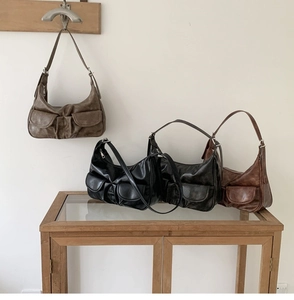 Retro shoulder bags in various colors featuring dual front pockets and soft ruched leather
