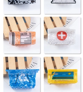 Detailed views of creative acetate hair claws in medical and recycle bin shapes
