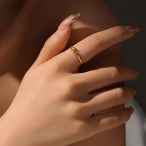 Minimalist S925 sterling silver adjustable golden twisted ring on a finger