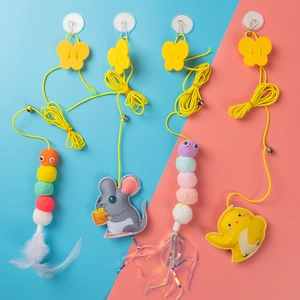 Detail of hanging cat toys with elastic string, suction cup, bells and felt mice