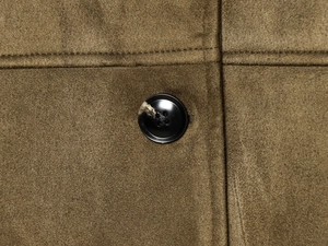 Macro shot of faux suede jacket showing texture and black marbled button detail