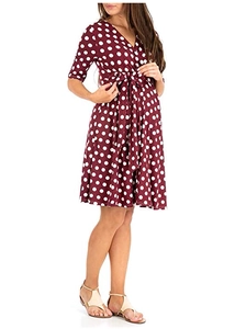 Detail of burgundy polka dot dress featuring a V-neck and drawstring waist design
