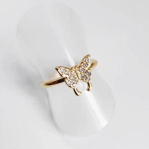 Detailed macro view of the butterfly ring featuring micro-pave crystals in gold finish