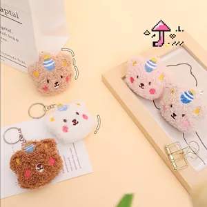 Plush panda bear keychain charms in multiple colors with cute hats and metal rings
