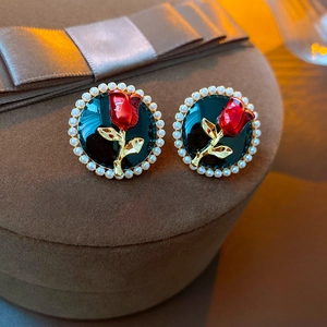 French vintage tulip pearl earrings with red enamel rose and golden stems on velvet