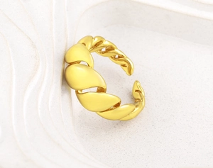 Close-up of 18K gold plated adjustable ring with unique braided wheat grain texture