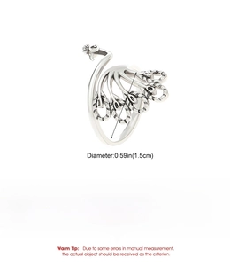 Detail view of retro peacock ring showing intricate hollow feathers and silver copper finish