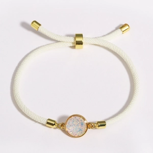 Adjustable beige braided rope bracelet with golden accents and opal-style charm