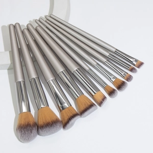 Professional 11-piece champagne gold makeup brush set with silver handles and soft bristles