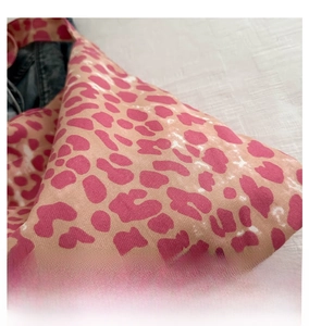 Detailed close-up of the pink leopard print pattern on high-quality tote bag fabric