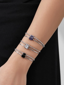 Detail view of double-layered stainless steel bracelet with square cubic zirconia inlays